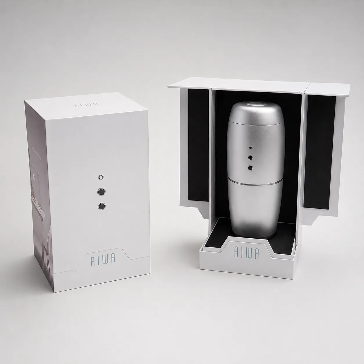 AIWA packaging shown beside the object revealed in its display cradle.
