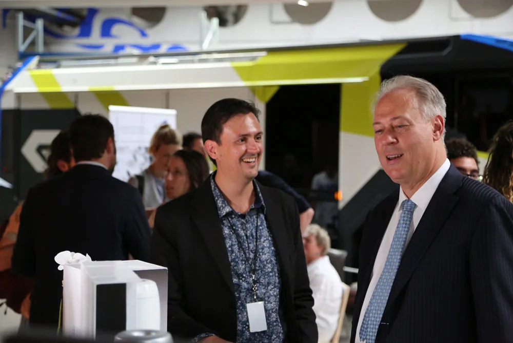 AIWA being discussed in a public showcase setting.
